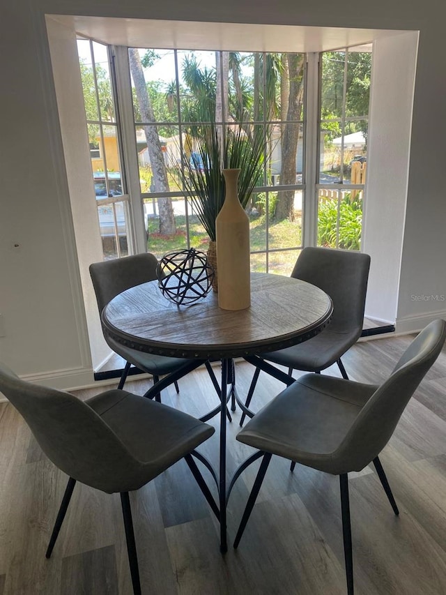 1397 43rd St, Sarasota, FL 34234 - dining room with plenty of natural light and wood finished floors