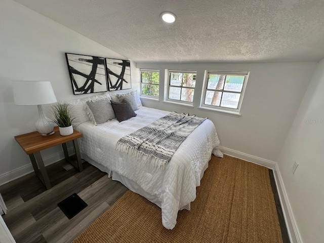 1397 43rd St, Sarasota, FL 34234 - bedroom with a textured ceiling and wood finished floors