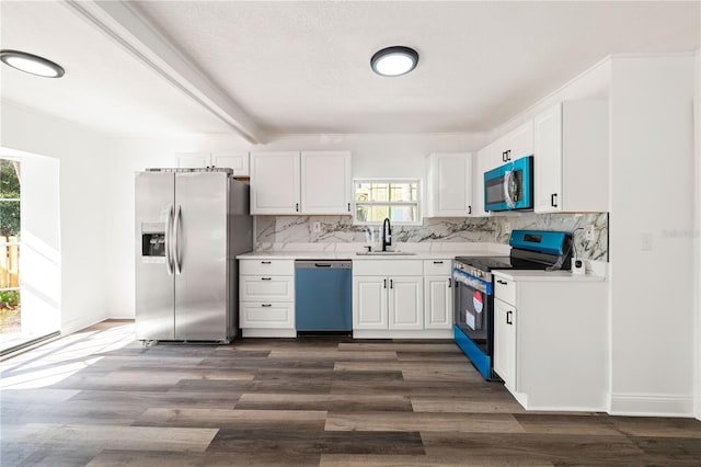 1397 43rd St, Sarasota, FL 34234 - kitchen with stainless steel appliances, tasteful backsplash, and white cabinets
