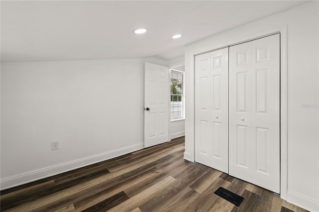 1397 43rd St, Sarasota, FL 34234 - unfurnished bedroom featuring recessed lighting, dark wood-type flooring, vaulted ceiling, and a closet