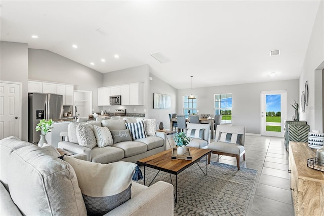 living room featuring high vaulted ceiling, recessed lighting, visible vents, and light tile patterned floors