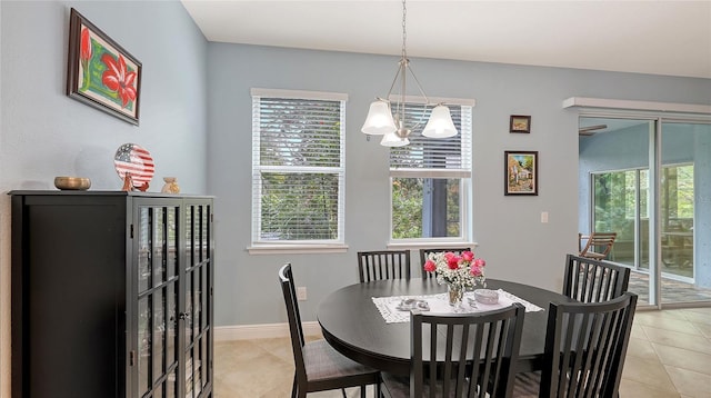 dining area with light tile patterned floors and baseboards