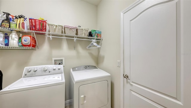 laundry area with laundry area and separate washer and dryer