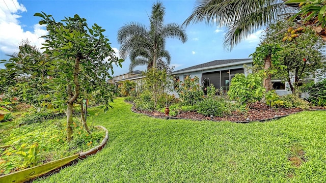 view of yard with a sunroom