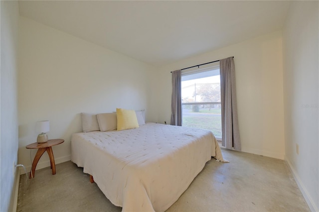 bedroom featuring baseboards