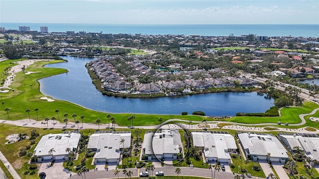 drone / aerial view featuring a water view and golf course view