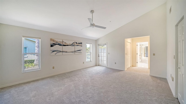 unfurnished bedroom featuring light carpet, baseboards, ceiling fan, access to outside, and high vaulted ceiling