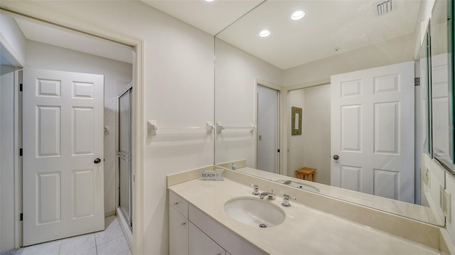 full bathroom featuring tile patterned flooring, recessed lighting, vanity, visible vents, and a stall shower