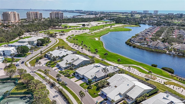 birds eye view of property with a view of city and a water view