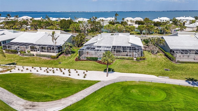 drone / aerial view with a residential view and a water view