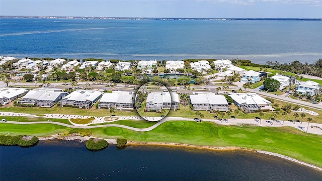 birds eye view of property featuring a residential view, view of golf course, and a water view