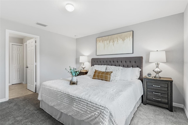 bedroom featuring carpet floors, baseboards, and visible vents