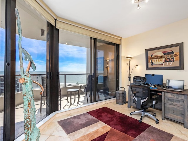 home office featuring floor to ceiling windows