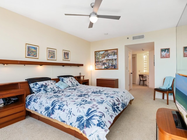 carpeted bedroom featuring ceiling fan and visible vents