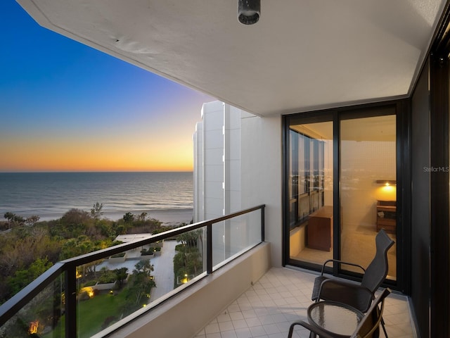 balcony featuring a water view