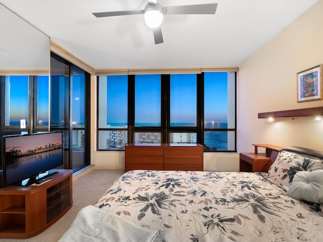 carpeted bedroom with a ceiling fan