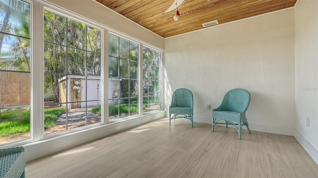 unfurnished sunroom featuring wood ceiling