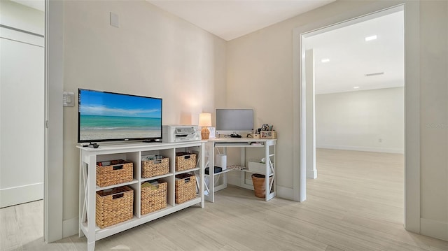 interior space featuring wood finished floors and baseboards