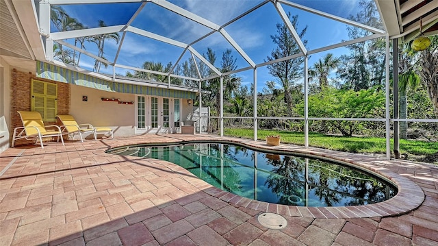 pool featuring a lanai and a patio