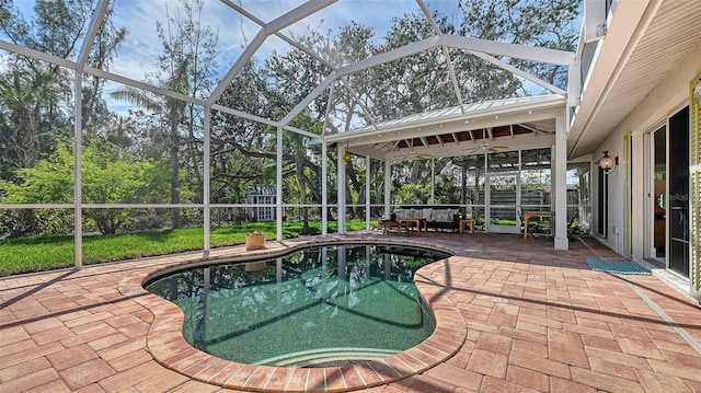 view of pool featuring a lanai and a patio