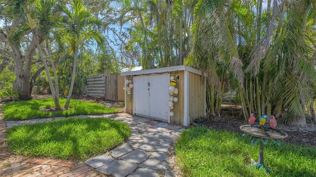 view of shed with fence