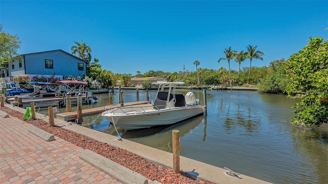 view of dock with a water view and boat lift