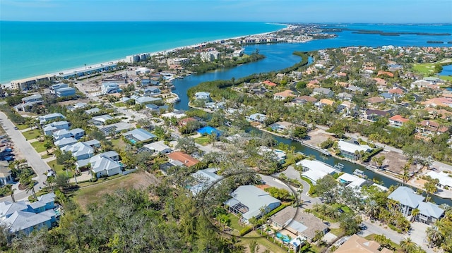 drone / aerial view with a residential view and a water view