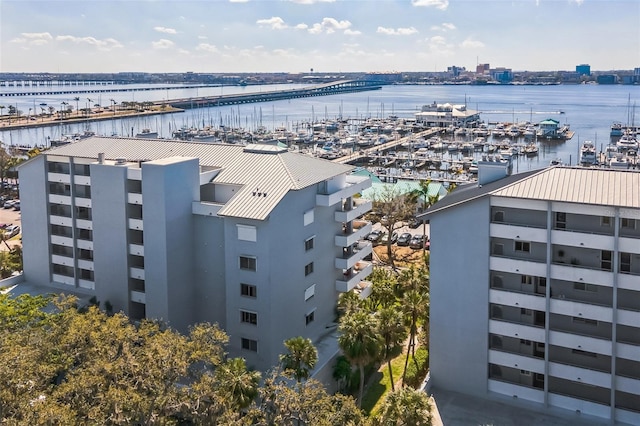 drone / aerial view featuring a water view and a city view