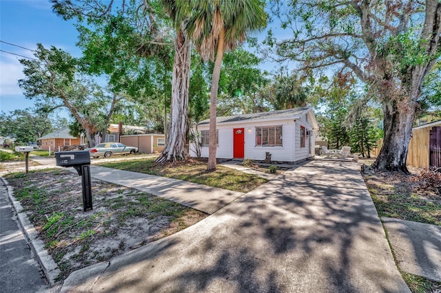 view of front of property featuring fence
