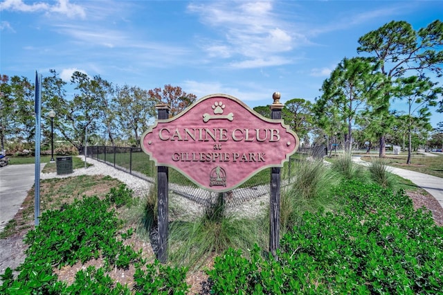 community sign featuring fence
