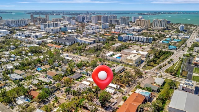 drone / aerial view featuring a water view and a city view