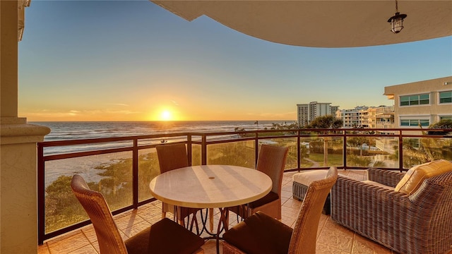 balcony at dusk with a water view