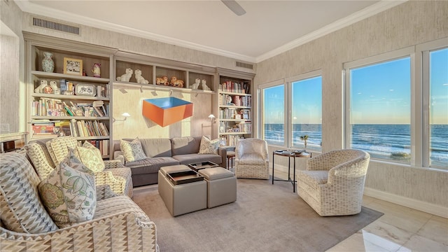 living area with baseboards, visible vents, a water view, and ornamental molding