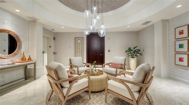 interior space featuring visible vents, recessed lighting, marble finish floor, and a raised ceiling