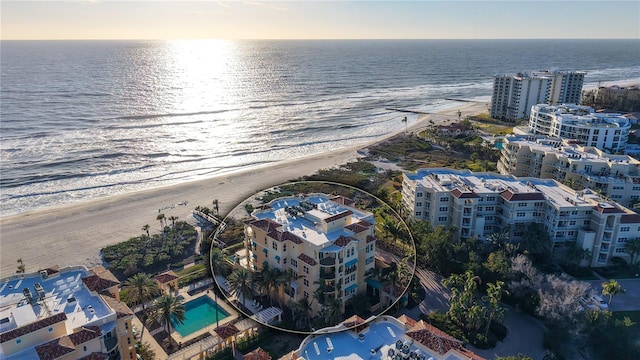 bird's eye view featuring a view of the beach and a water view