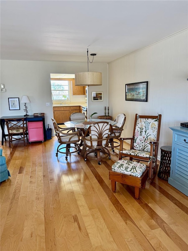 dining area with light wood-style flooring