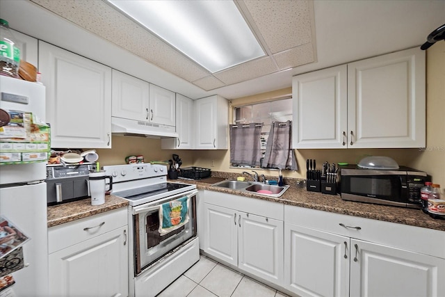 kitchen with under cabinet range hood, white appliances, white cabinets, and a sink