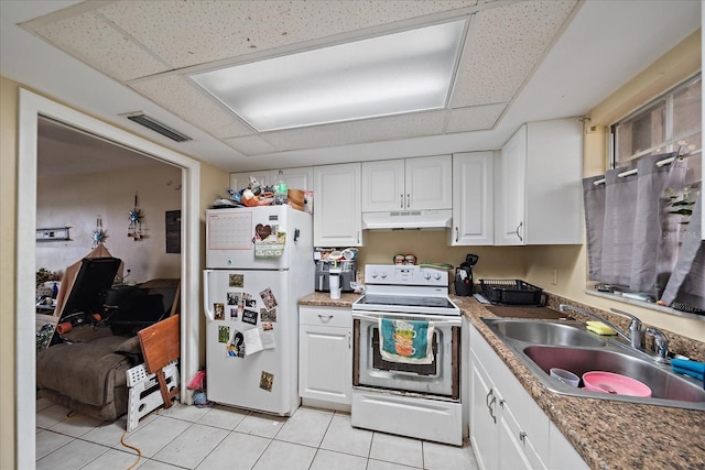 kitchen with visible vents, under cabinet range hood, a sink, white appliances, and white cabinets