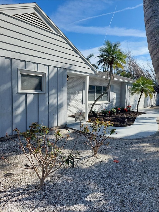 view of property exterior featuring brick siding