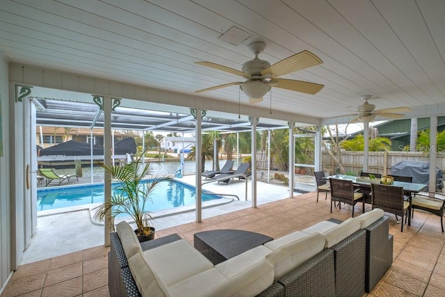 552 Juan Anasco Dr, Longboat Key, FL 34228 - sunroom / solarium with outdoor lounge area, outdoor dining space, and a ceiling fan
