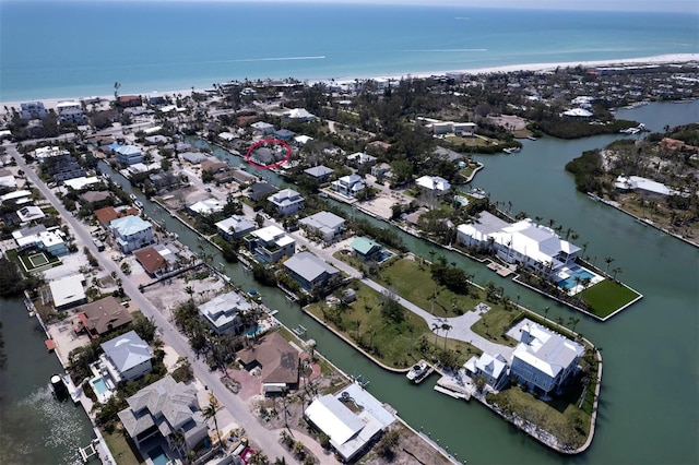 552 Juan Anasco Dr, Longboat Key, FL 34228 - aerial view of property and surrounding area featuring a large body of water and nearby suburban area
