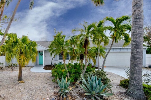552 Juan Anasco Dr, Longboat Key, FL 34228 - obstructed view of property with driveway and fence