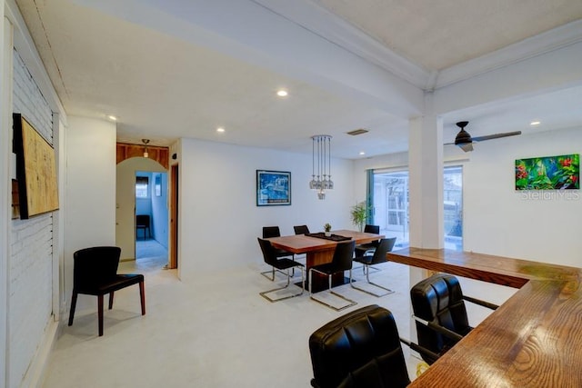 552 Juan Anasco Dr, Longboat Key, FL 34228 - dining space with arched walkways, recessed lighting, light carpet, a desk, and ornamental molding