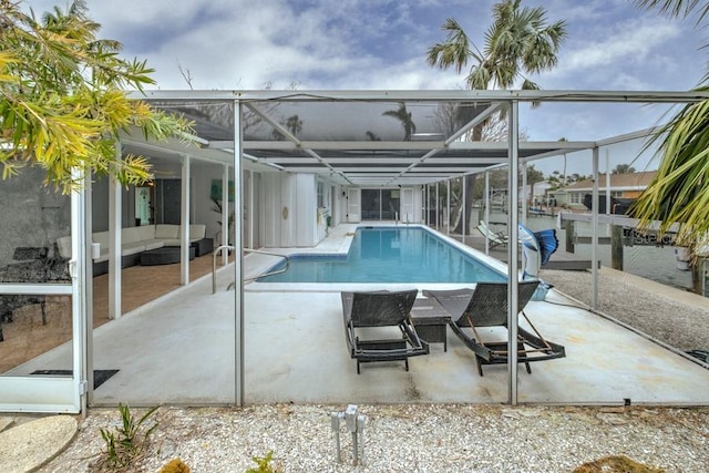 552 Juan Anasco Dr, Longboat Key, FL 34228 - outdoor pool with a patio area, outdoor lounge area, and glass enclosure