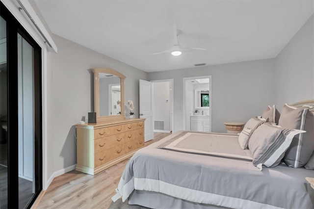 bedroom featuring baseboards, ceiling fan, visible vents, and light wood-style floors