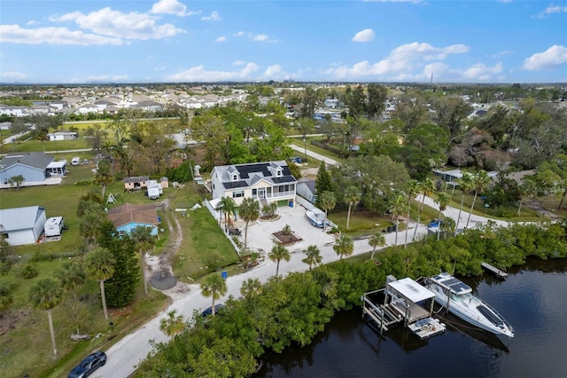 aerial view with a water view and a residential view