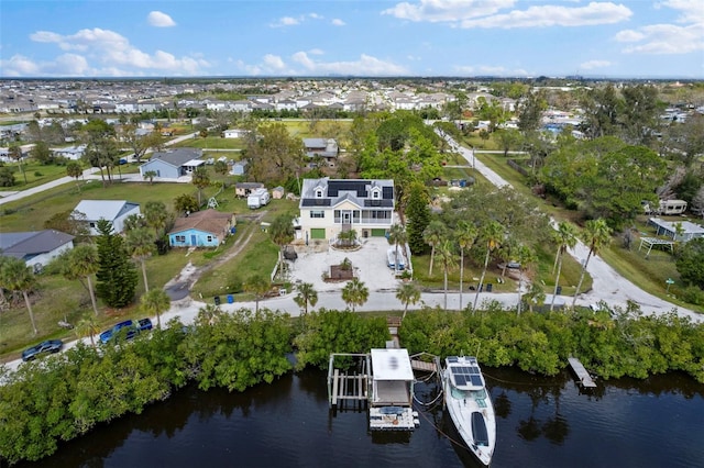 aerial view featuring a water view and a residential view