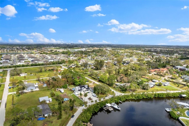 bird's eye view with a water view and a residential view