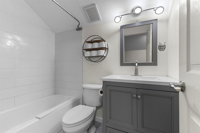 full bathroom featuring visible vents, toilet, washtub / shower combination, vaulted ceiling, and vanity