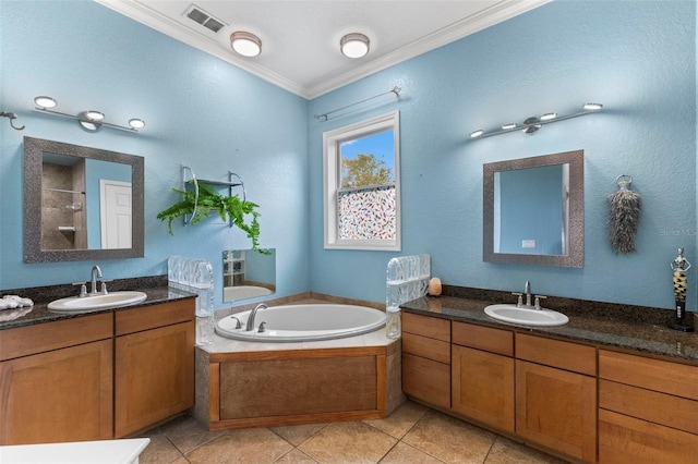 bathroom with a garden tub, ornamental molding, a sink, and visible vents